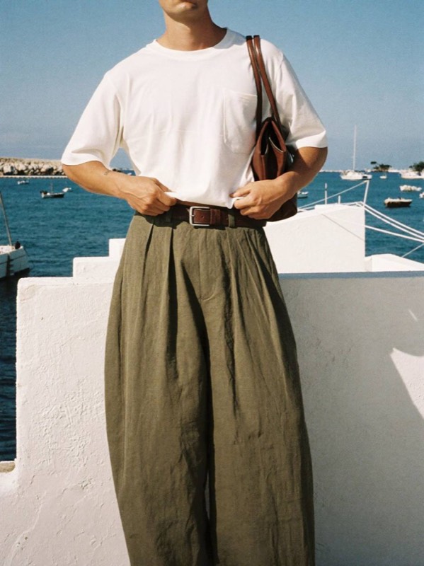 Boxy crop tee with double-pleat olive trousers by the sea